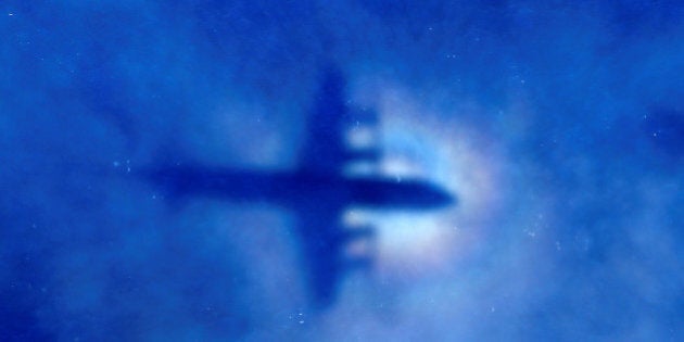 FILE PHOTO: The shadow of a Royal New Zealand Air Force (RNZAF) P3 Orion maritime search aircraft can be seen on low-level clouds as it flies over the southern Indian Ocean looking for missing Malaysian Airlines flight MH370 March 31, 2014. REUTERS/Rob Griffith/Pool/File photo TPX IMAGES OF THE DAY