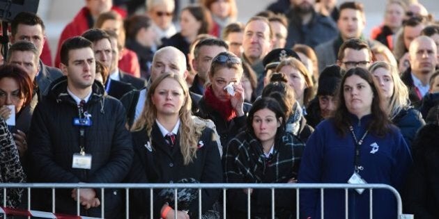 Employees at Brussels' international airport in Zaventem gather for a memorial ceremony to mark the first anniversary of the twin Brussels attacks by Islamic extremists on March 22, 2017.Belgium marks the first anniversary of the Islamic State bombings in Brussels, one at the airport and the other in the metro, in which 32 people were killed and more than 320 wounded with ceremonies showing that the heart of Europe stands defiant. / AFP PHOTO / BELGA AND AFP PHOTO / Emmanuel DUNAND (Photo credit should read EMMANUEL DUNAND/AFP/Getty Images)