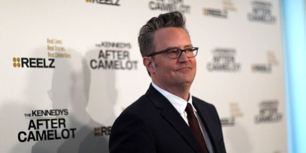 Cast member Matthew Perry poses at the premiere for the television series