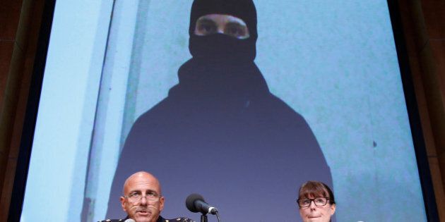 An image of Aaron Driver, a Canadian man killed by police on Wednesday who had indicated he planned to carry out an imminent rush-hour attack on a major Canadian city, is projected on a screen during a news conference with Royal Canadian Mounted Police (RCMP) Deputy Commissioner Mike Cabana (L) and Assistant Commissioner Jennifer Strachan in Ottawa, Ontario, Canada, August 11, 2016. REUTERS/Chris Wattie