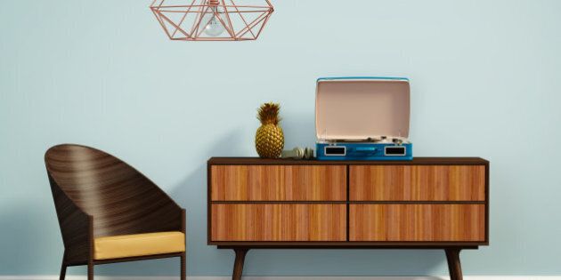 Rendering of a blue interior with mid century chair and buffet
