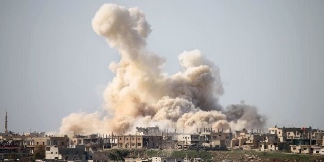 Smoke billows following reported air strikes on a rebel-held area in the southern city of Daraa, on February 27, 2017.Daraa province, the cradle of the 2011 uprising against President Bashar al-Assad's regime, is mostly held by the rebels but pro-government forces and Islamic State are also present. / AFP / MOHAMAD ABAZEED (Photo credit should read MOHAMAD ABAZEED/AFP/Getty Images)