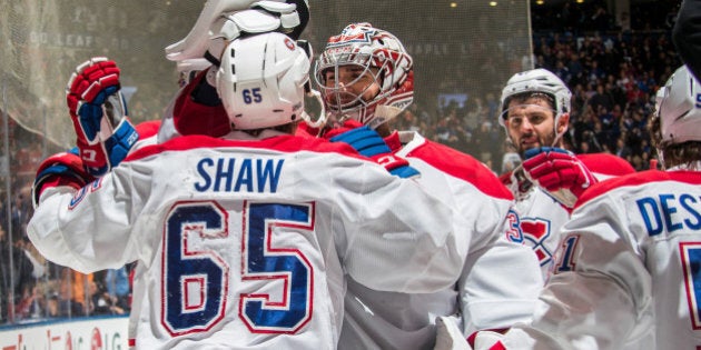 TORONTO, ON - FEBRUARY 25: Andrew Shaw #65 of the Montreal Canadiens is congratulated on his game winning overtime goal against the Toronto Maple Leafs by teammate Carey Price #31 at the Air Canada Centre on February 25, 2017 in Toronto, Ontario, Canada. (Photo by Mark Blinch/NHLI via Getty Images)