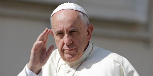 Pope Francis waves as he arrives for his weekly general audience, in St. Peter's Square at the Vatican, Wednesday, June 17, 2015. (AP Photo/Andrew Medichini)