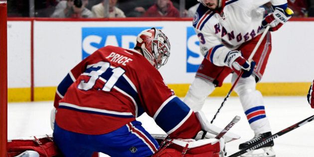Apr 20, 2017; Montreal, Quebec, CAN; Montreal Canadiens goalie Carey Price (31) makes a save against New York Rangers forward Mika Zibanejad (93) during the second period in game five of the first round of the 2017 Stanley Cup Playoffs at the Bell Centre. Mandatory Credit: Eric Bolte-USA TODAY Sports