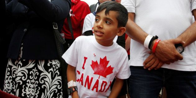 A Syrian refugee waits to shake hands with Canada's Prime Minister Justin Trudeau (not pictured) during Canada Day celebrations on Parliament Hill in Ottawa, Ontario, Canada, July 1, 2016. REUTERS/Chris Wattie