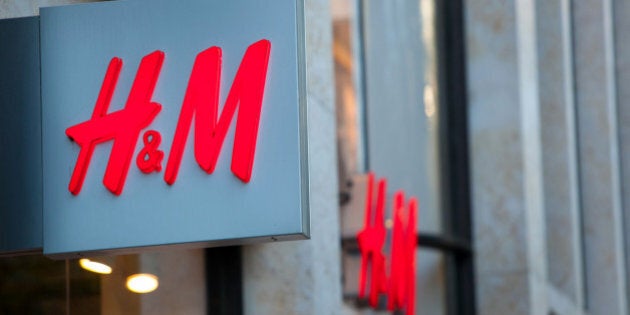 A H&M logo sits on display outside a fashion clothing store operated by Hennes & Mauritz AB in Dusseldorf, Germany, on Tuesday, Oct. 1, 2013. The Bundesbank said last month that German growth is still being supported by an 'extraordinarily good' consumer climate, in part due to the labor market. Photographer: Krisztian Bocsi/Bloomberg via Getty Images