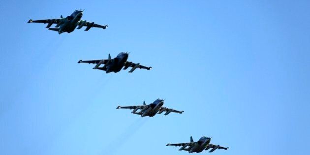 Russian Su-25 ground attack jets prepare to land after return from Syria at a Russian air base in Primorsko-Akhtarsk, southern Russia, Wednesday, March 16, 2016. More Russian planes returned from Syria on Wednesday, two days after President Vladimir Putin ordered Russian military to withdraw most of its fighting forces from Syria, signaling an end to Russia's five-and-a-half month air campaign.(Olga Balashova/Russian Defense Ministry Press Service via AP)