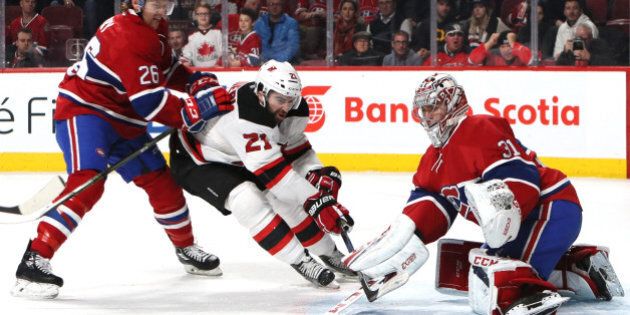 Dec 8, 2016; Montreal, Quebec, CAN; Montreal Canadiens goalie Carey Price (31) makes a save against New Jersey Devils right wing Kyle Palmieri (21) as defenseman Jeff Petry (26) defends during the first period at Bell Centre. Mandatory Credit: Jean-Yves Ahern-USA TODAY SportsODAY Sports