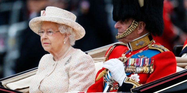 Britain's Queen Elizabeth and Prince Philip return to Buckingham Palace by carriage after attending the Trooping the Colour ceremony at Horse Guards Parade in central London, Britain June 13, 2015. Trooping the Colour is a ceremony to honour the Queen's official birthday. REUTERS/Stefan Wermuth
