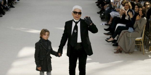 German designer Karl Lagerfeld and model Hudson Kroenig appear at the end of his Fall/Winter 2016/2017 women's ready-to-wear collection for fashion house Chanel at the Grand Palais in Paris, France, March 8, 2016. REUTERS/Gonzalo Fuentes TPX IMAGES OF THE DAY