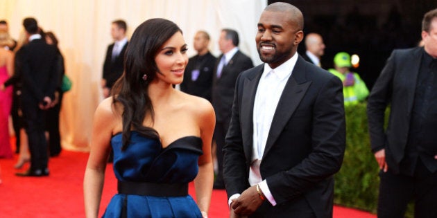 NEW YORK, NY - MAY 05: Kim Kardashian (L) and Kanye West attend the 'Charles James: Beyond Fashion' Costume Institute Gala at the Metropolitan Museum of Art on May 5, 2014 in New York City. (Photo by Mike Coppola/Getty Images)