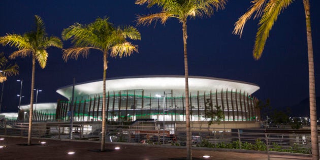 The Carioca Arena 1 is seen behind palm trees at the Rio 2016 Olympic Park in Rio de Janeiro, Brazil, Monday, April 11, 2016. During the Olympic Games the arena will host basketball matches. (AP Photo/Felipe Dana)