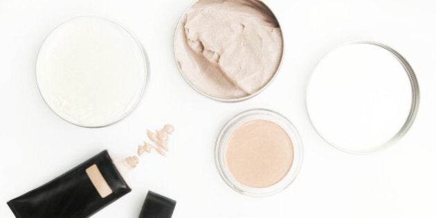 Top view of different cosmetics products on the white background