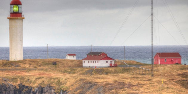 The Cape Race lighthouse towers over surrounding buildings. It played a major role in relaying news of the 'Titanic.'