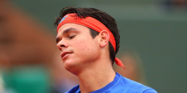 PARIS, FRANCE - MAY 29: Milos Raonic of Canada reacts during the Men's Singles fourth round match against Alberto Ramos Vinolas of Spain on day eight of the 2016 French Open at Roland Garros on May 29, 2016 in Paris, France. (Photo by Julian Finney/Getty Images)