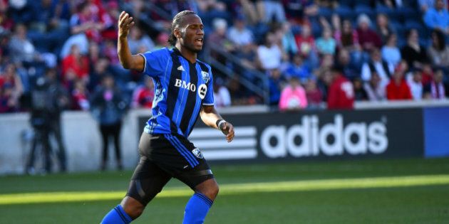 Apr 16, 2016; Chicago, IL, USA; Montreal Impact forward Didier Drogba (11) reacts after scoring a goal against the Chicago Fire during the second half at Toyota Park. Mandatory Credit: Mike DiNovo-USA TODAY Sports