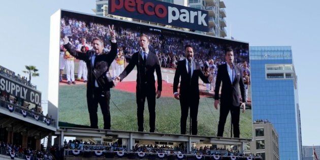 The Tenors, shown on the scoreboard, perform during the Canadian National Anthem prior to the MLB baseball All-Star Game, Tuesday, July 12, 2016, in San Diego. (AP Photo/Gregory Bull)