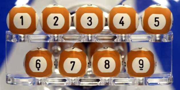 Balls are seen during a rehearsal of the draw of the new Euro-million loto at Boulogne-Billancourt near Paris, February 13, 2004. The Euro-million loto will be played simultaneously in England, Spain and France with a weekly French draw with a possible jackpot of over 30 million euros (35 million dollars). REUTERS/Charles Platiau CP/ACM