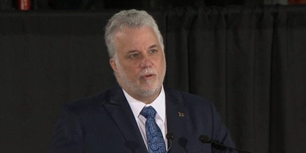 MONTREAL, CANADA - FEBRUARY 2: Premier of Quebec, Philippe Couillard delivers a speech during a funeral ceremony held for six people, who were killed in a shooting at a mosque in Quebec City late Sunday, at Maurice Richard Arena in Montreal, Canada on February 2, 2017. (Photo by Seyit Aydogan/Anadolu Agency/Getty Images)