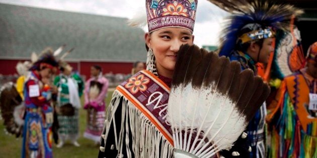 A young Miss Manito Abhee Sage Speidel, 14, from the Lakota nation, wears traditional clothing at an event celebrating National Aboriginal Day in Winnipeg, Manitoba, Tuesday, June 21, 2011. More than 1 million Canadians are of Aboriginal origin, and the nation has more than 600 recognized First Nations governments. (AP Photo/Kevin Frayer)