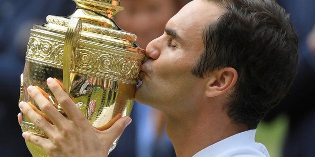 Tennis - Wimbledon - London, Britain - July 16, 2017 Switzerland?s Roger Federer celebrates with the trophy after winning the final against Croatia?s Marin Cilic REUTERS/Toby Melville