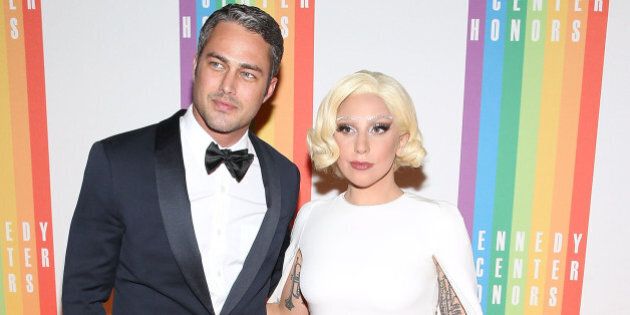 WASHINGTON, DC - DECEMBER 07: Taylor Kinney and Lady Gaga arrive at the 37th Annual Kennedy Center Honors at the John F. Kennedy Center for the Performing Arts on December 7, 2014 in Washington, DC. (Photo by Paul Morigi/WireImage)