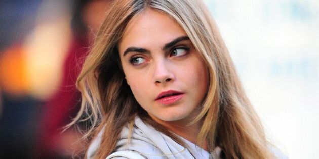 NEW YORK, NY - OCTOBER 15: Model Cara Delevingne is seen on the set of a DKNY photoshoot on October 15, 2013 in New York City. (Photo by Raymond Hall/FilmMagic)