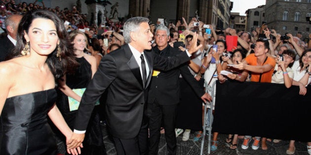 FLORENCE, ITALY - SEPTEMBER 07: Amal Alamuddin and George Clooney attend the Celebrity Fight Night In Italy Benefitting The Andrea Bocelli Foundation and The Muhammad Ali Parkinson Center Gala on September 7, 2014 in Florence, Italy. (Photo by Andrew Goodman/Getty Images for Celebrity Fight Night)