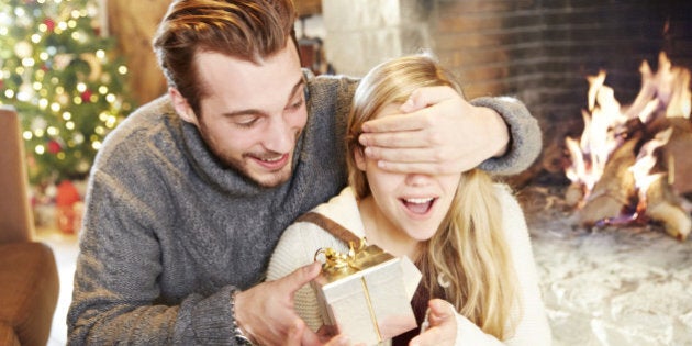 Couple exchanging gifts on Christmas