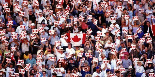 23 Jul 1999: A view of fans waving Canadian flags in the opening ceremony of the Pan-American Games at Winnipeg, Manitoba, Canada. Mandatory Credit: Donald Miralle /Allsport