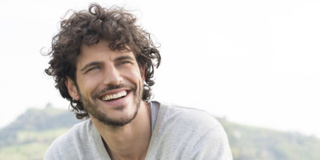 Portrait Of Young Handsome Man Smiling Outdoor