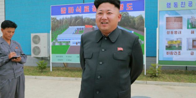 North Korean leader Kim Jung Un visits the newly commissioned Kalma Foodstuff Factory in this undated photo released by North Korea's Korean Central News Agency (KCNA) in Pyongyang August 15, 2014. REUTERS/KCNA (NORTH KOREA - Tags: POLITICS FOOD) ATTENTION EDITORS - THIS PICTURE WAS PROVIDED BY A THIRD PARTY. REUTERS IS UNABLE TO INDEPENDENTLY VERIFY THE AUTHENTICITY, CONTENT, LOCATION OR DATE OF THIS IMAGE. FOR EDITORIAL USE ONLY. NOT FOR SALE FOR MARKETING OR ADVERTISING CAMPAIGNS. THIS PICTURE IS DISTRIBUTED EXACTLY AS RECEIVED BY REUTERS, AS A SERVICE TO CLIENTS. NO THIRD PARTY SALES. NOT FOR USE BY REUTERS THIRD PARTY DISTRIBUTORS. SOUTH KOREA OUT. NO COMMERCIAL OR EDITORIAL SALES IN SOUTH KOREA