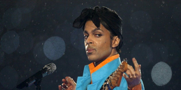 Prince performs during the halftime show of the NFL's Super Bowl XLI football game between the Chicago Bears and the Indianapolis Colts in Miami, Florida, U.S. February 4, 2007. REUTERS/Mike Blake/File Photo TPX IMAGES OF THE DAY