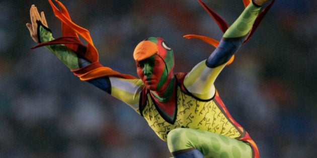 A Cirque du Soleil performer is seen during the pre-game show for the Super Bowl XLI football game at Dolphin Stadium in Miami on Sunday, Feb. 4, 2007. (AP Photo/Mark J. Terrill)