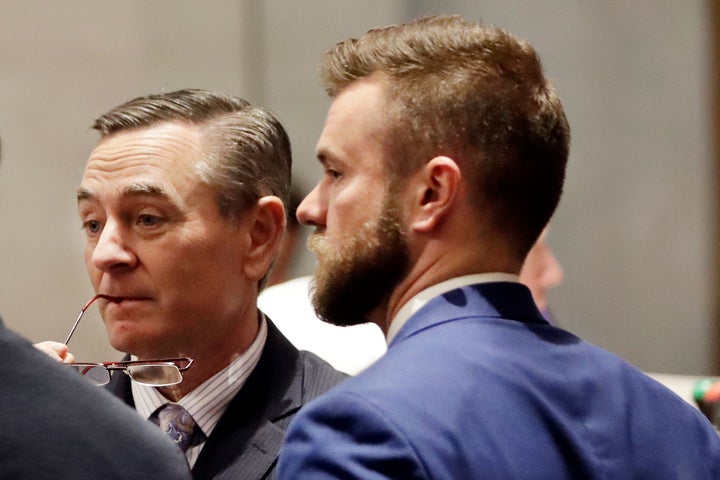 House Speaker Glen Casada (R-Franklin), left, talks with Cade Cothren, right, his chief of staff, during a House session in Nashville, Tenn. Cothren has resigned amid allegations of sending racist and sexually explicit texts.