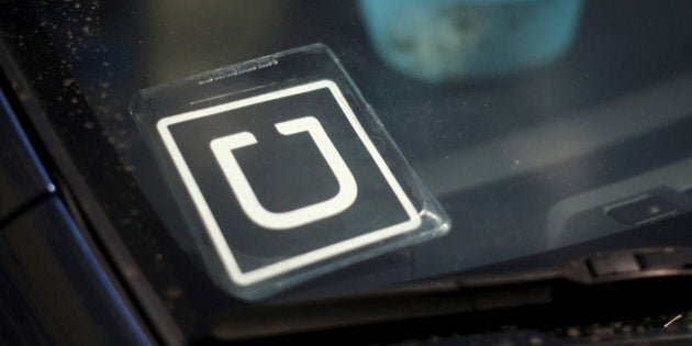 An Uber car is seen parked with the driver's lunch left on the dashboard in Venice, California, United States on July 15, 2015. REUTERS/Lucy Nicholson/File Photo