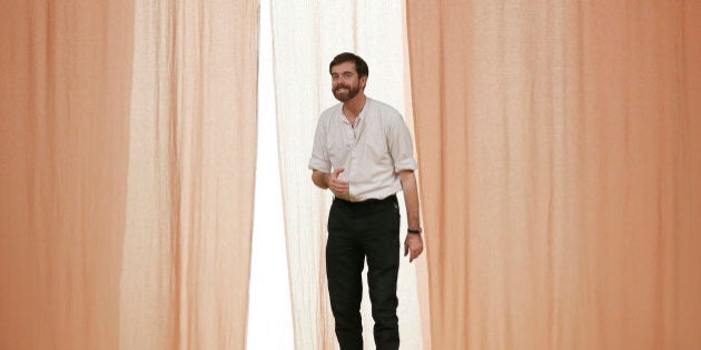 French designer Christophe Lemaire appears at the end of his Spring/Summer 2015 women's ready-to-wear collection for fashion house Hermes during Paris Fashion Week October 1, 2014. REUTERS/Gonzalo Fuentes (FRANCE - Tags: FASHION)