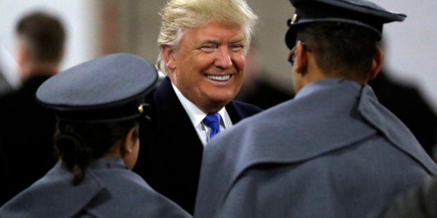 President-elect Donald Trump, center, greets Army Cadets before the Army-Navy NCAA college football game in Baltimore, Saturday, Dec. 10, 2016. (AP Photo/Patrick Semansky)