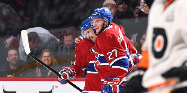 MONTREAL, QC - FEBRUARY 10: Tomas Plekanec #14 celebrates with Alex Galchenyuk #27 of the Montreal Canadiens after scoring a goal against the Philadelphia Flyers in the NHL game at the Bell Centre on February 10, 2015 in Montreal, Quebec, Canada. (Photo by Francois Lacasse/NHLI via Getty Images)