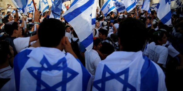 Israelis carry flags during a march marking Jerusalem Day, the anniversary of Israel's capture of East Jerusalem during the 1967 Middle East war, just outside Damascus Gate of Jerusalem's Old City June 5, 2016. REUTERS/Ammar Awad