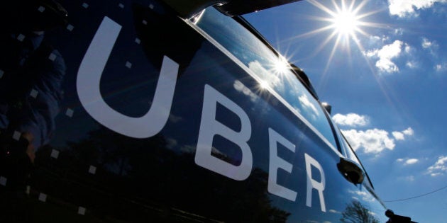 FILE - In this Monday, Sept. 12, 2016, file photo, a self-driving Uber sits ready to take journalists for a ride during a media preview in Pittsburgh. Ride-hailing company Uber Technologies Inc., announced Monday, Sept. 19, that the company will soon open an office in Detroit. The San Francisco-based company wouldnât confirm where the facility will be located or how many people will work there, but ties between Detroit and Silicon Valley are growing as research into self-driving cars accelerates. (AP Photo/Gene J. Puskar, File)