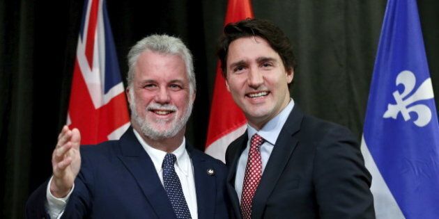Canada's Prime Minister Justin Trudeau (R) poses with Quebec Premier Philippe Couillard during the First Ministers' meeting in Ottawa, Canada November 23, 2015. REUTERS/Chris Wattie