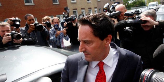 Montreal mayor Michael Applebaum is surrounded by media as he leaves the Surete du Quebec headquarters following his arrest in Montreal, June 17, 2013. Applebaum was arrested at his home Monday morning and was charged with 14 offences including breach of trust, fraud, municipal corruption, conspiracy and receiving secret commissions, according to the head of the anti-corruption team, Robert Lafreniere. REUTERS/Christinne Muschi (CANADA - Tags: CRIME LAW POLITICS)