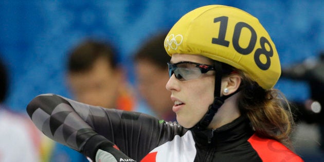 Marianne St-Gelais of Canada reacts after competing in a women's 1000m short track speedskating heat at the Iceberg Skating Palace during the 2014 Winter Olympics, Tuesday, Feb. 18, 2014, in Sochi, Russia. (AP Photo/David J. Phillip )