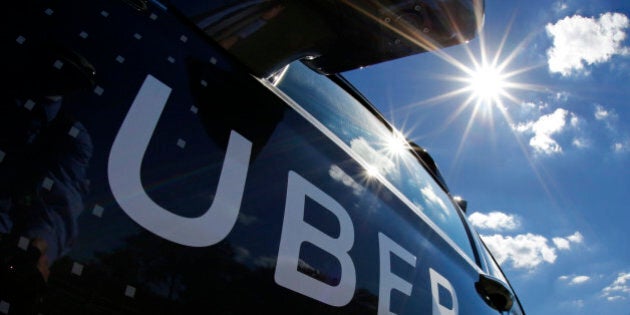 FILE - In this Monday, Sept. 12, 2016, file photo, a self-driving Uber sits ready to take journalists for a ride during a media preview in Pittsburgh. Ride-hailing company Uber Technologies Inc., announced Monday, Sept. 19, that the company will soon open an office in Detroit. The San Francisco-based company wouldnât confirm where the facility will be located or how many people will work there, but ties between Detroit and Silicon Valley are growing as research into self-driving cars accelerates. (AP Photo/Gene J. Puskar, File)