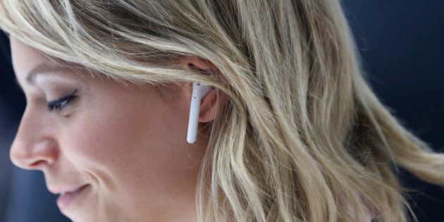 SAN FRANCISCO, CA - SEPTEMBER 07: An attendee wears an Apple AirPods during a launch event on September 7, 2016 in San Francisco, California. Apple Inc. unveiled the latest iterations of its smart phone, the iPhone 7 and 7 Plus, the Apple Watch Series 2, as well as AirPods, the tech giant's first wireless headphones. (Photo by Stephen Lam/Getty Images)