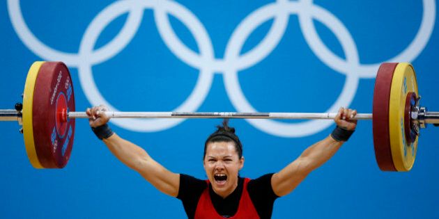 Canada's Christine Girard competes on the women's 63Kg weightlifting competition at the ExCel venue at the London 2012 Olympic Games July 31, 2012. REUTERS/Paul Hanna (BRITAIN - Tags: SPORT OLYMPICS SPORT WEIGHTLIFTING)