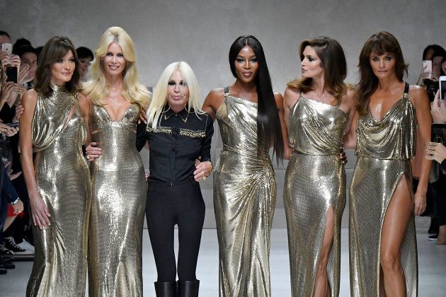 Carla Bruni, Claudia Schiffer, Donatella Versace, Naomi Campbell, Cindy Crawford and Helena Christensen walk the runway at the Versace Ready to Wear Spring/Summer 2018 fashion show during Milan Fashion Week Spring/Summer 2018 on September 22, 2017 in Milan, Italy. (Photo by Victor VIRGILE/Gamma-Rapho via Getty Images)