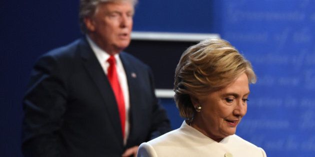 Democratic nominee Hillary Clinton (R) and Republican nominee Donald Trump walk off the stage after the final presidential debate at the Thomas & Mack Center on the campus of the University of Las Vegas in Las Vegas, Nevada on October 19, 2016. / AFP / Robyn Beck (Photo credit should read ROBYN BECK/AFP/Getty Images)